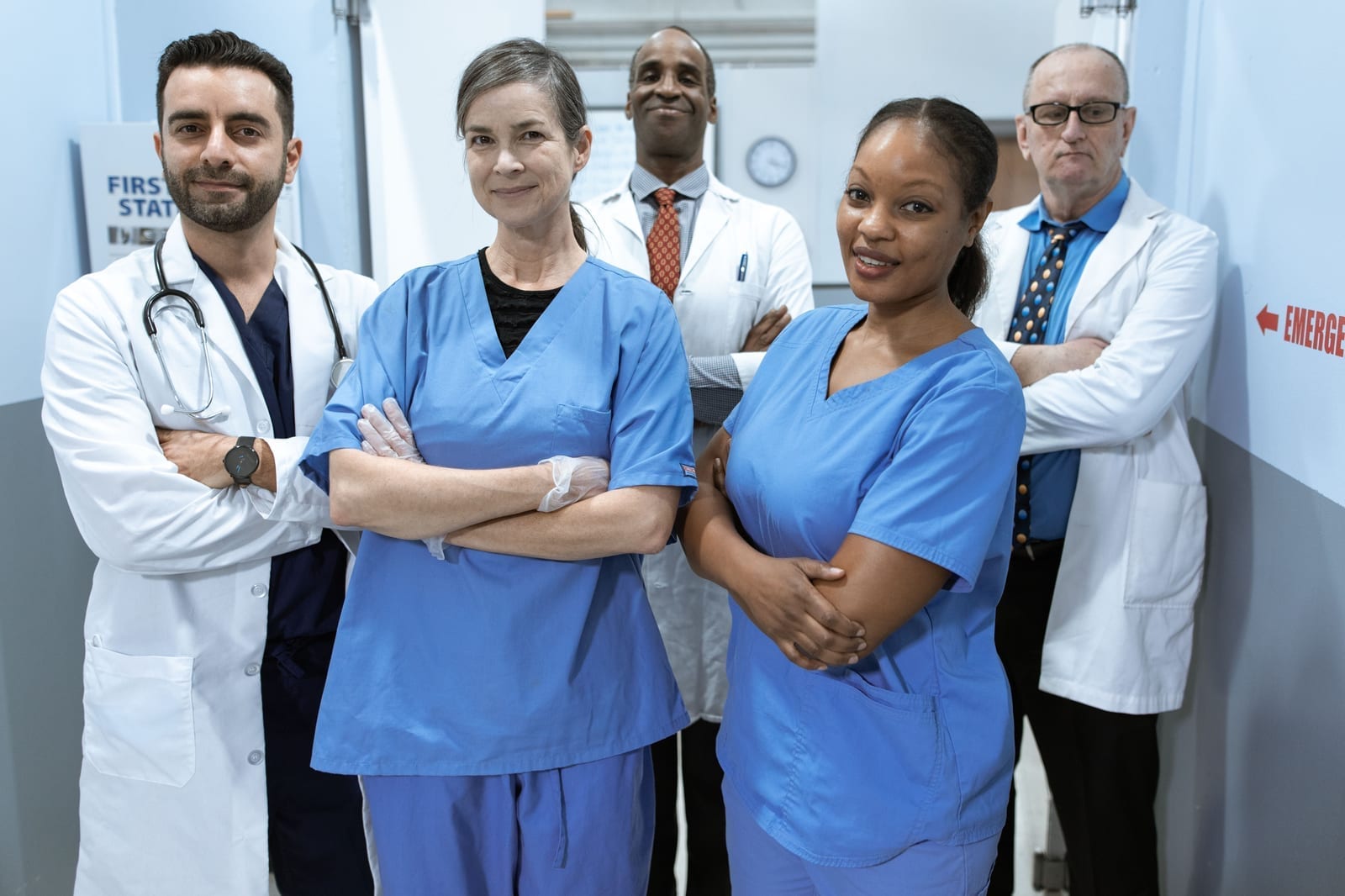 A team of doctors and nurses consulting together in a hospital