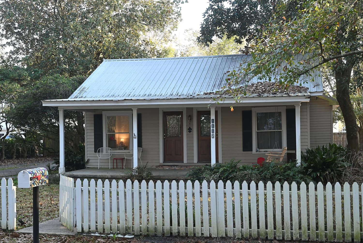 Frame houses with deep front porches along a street in the Marble Springs Historic District of Ocean Springs, Mississippi