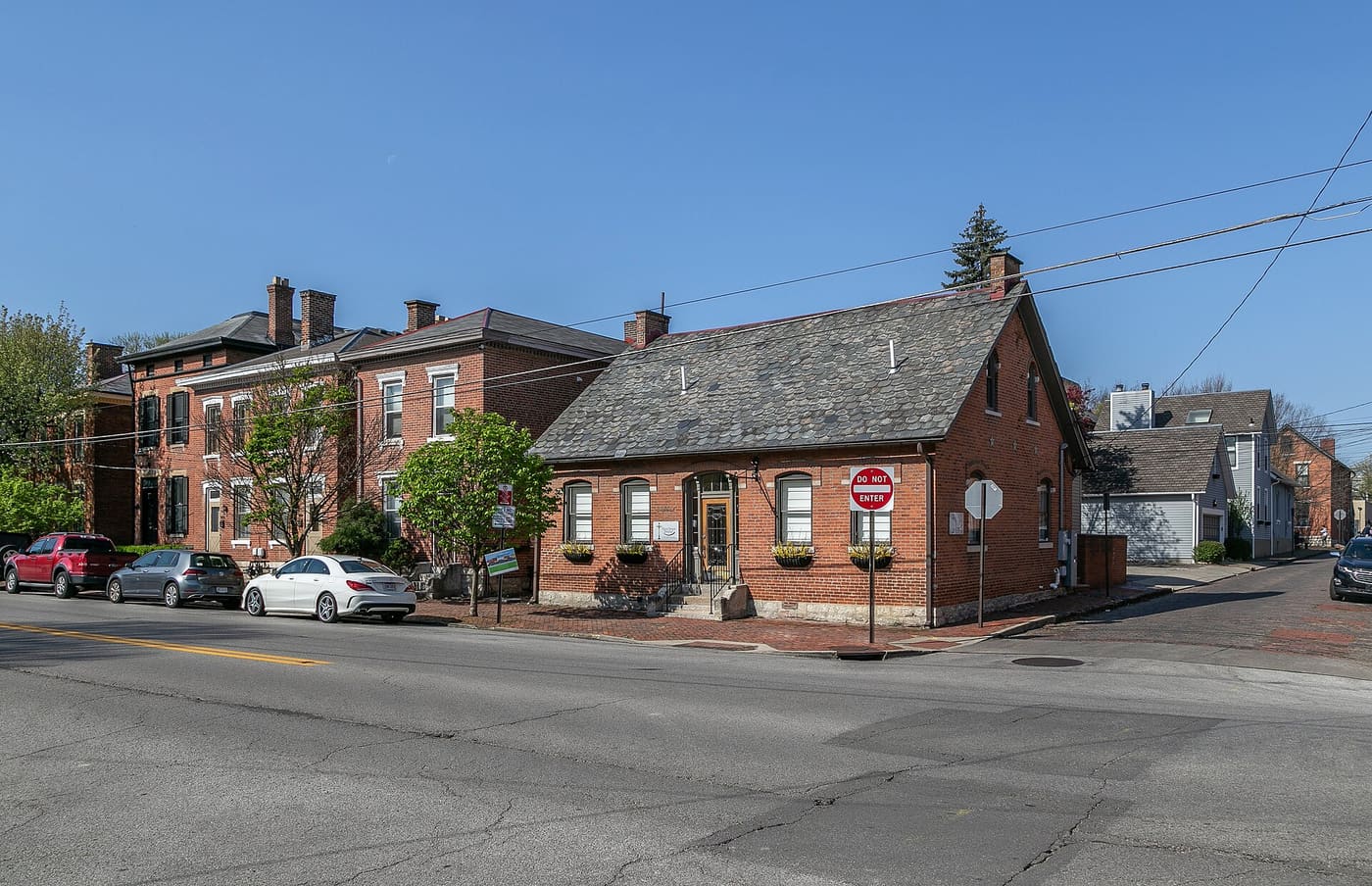 Brick houses with front stoops along a street in the German Village district of Columbus, Ohio